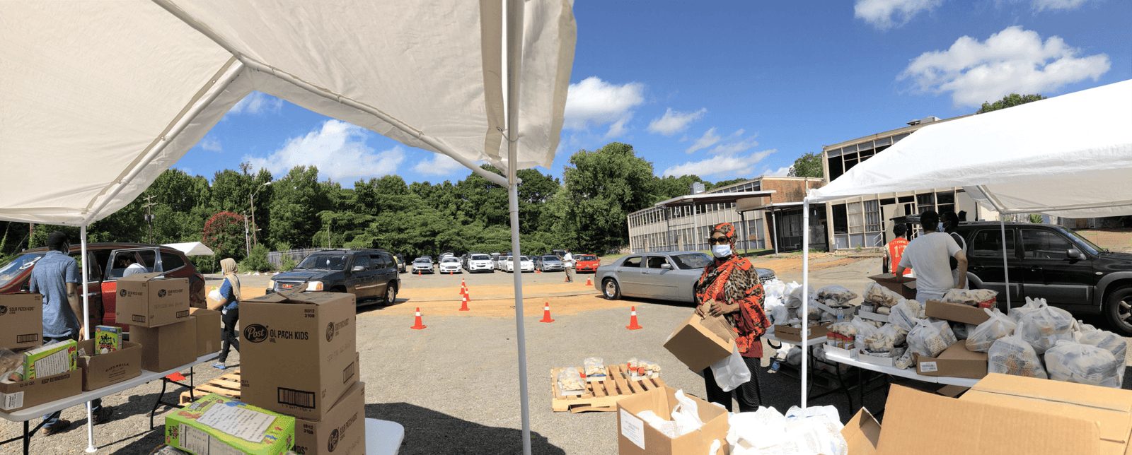 Volunteers distributing pantry food to cars at the Whitehaven campus.